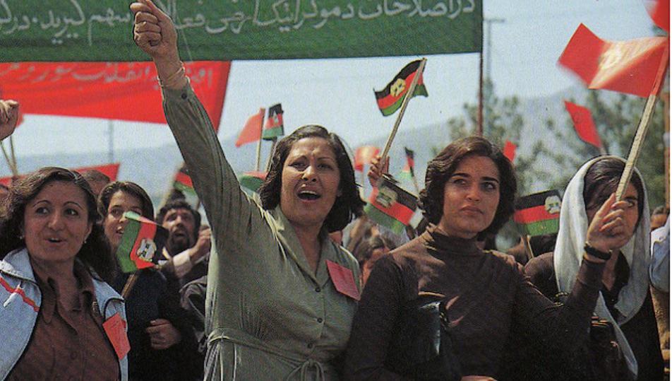 Citizens of Kabul rallying through the streets in support of the Afghan communist regime, 1980s. (960×540)
