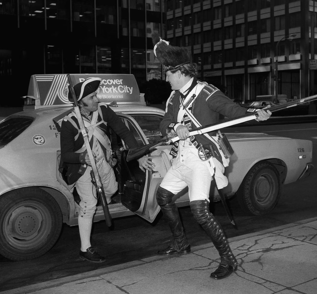 Men dressed as Revolutionary War soldiers exit a cab on the way to a bicentennial exhibit in New York, February 1976. Photo by Dave Pickoff, Associated Press [1280 x 1187].