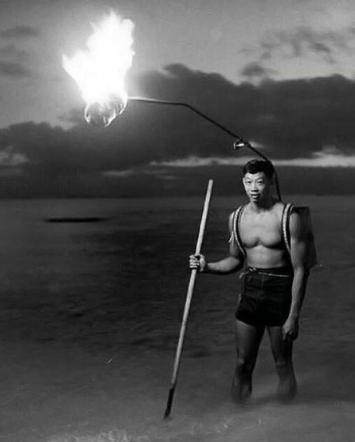 A man night fishing off the coast of Hawaii, 1948. [700 × 870]