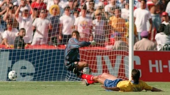 Andrés Escobar, the Colombian defender, scoring the tragic own goal against the USA during the 1994 World Cup that led to Colombia’s elimination. He was assassinated just days later in Medellín. [589×331]