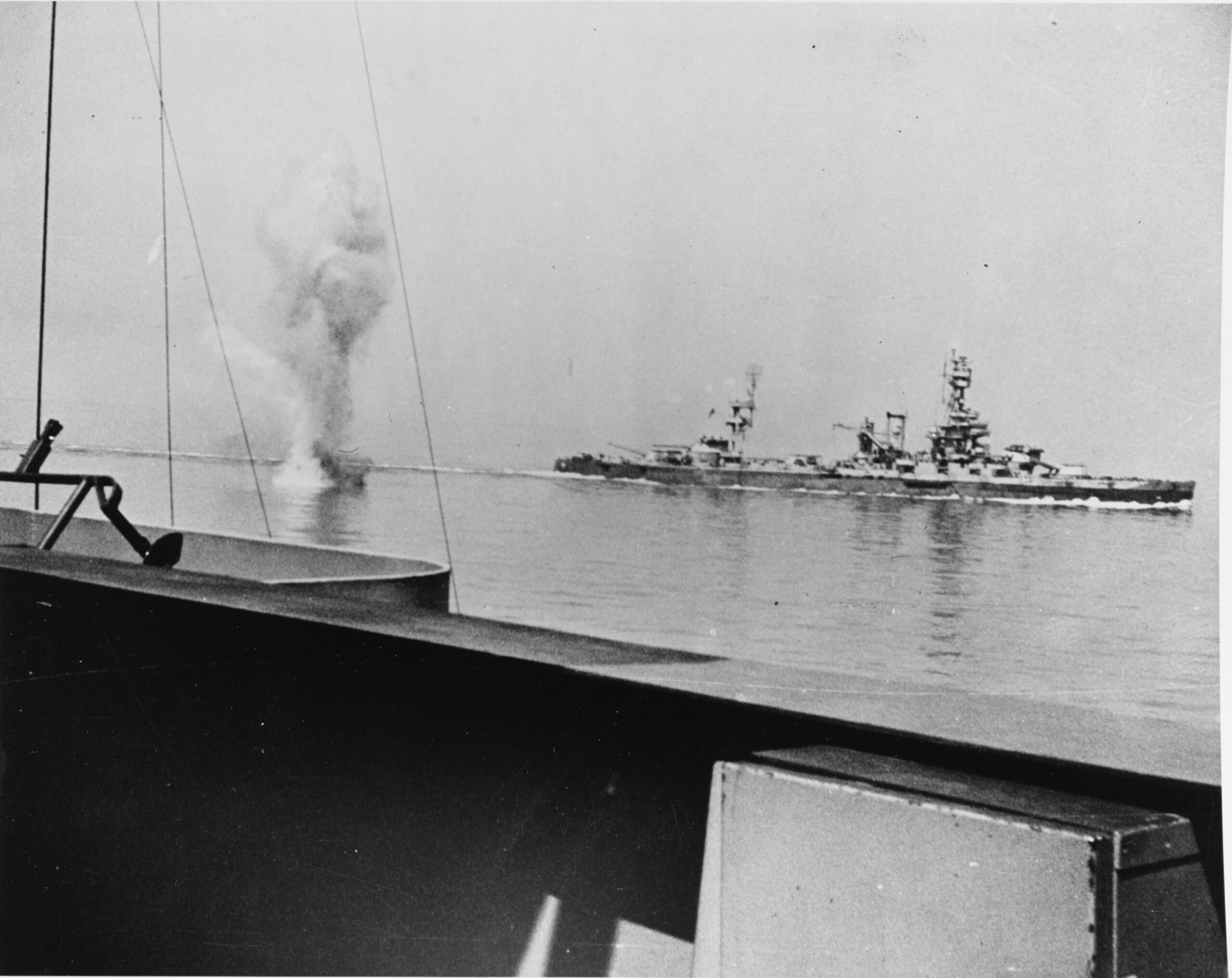 A heavy German coast artillery shell falls between USS Texas (BB-35) and USS Arkansas (BB-33), while the two battleships were engaging Battery Hamburg during the bombardment of Cherbourg, France, 25 June 1944 [3616 x 2872]