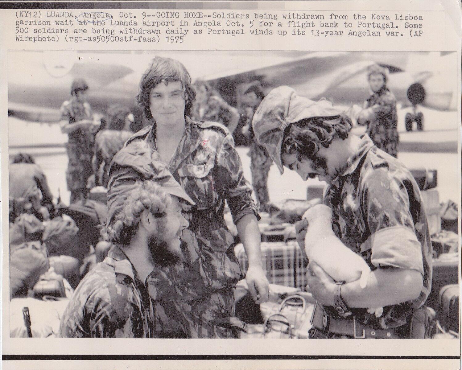 Soldiers wait for a flight back to Portugal at the Luanda airport in Angola as the Portuguese presence in Africa comes to an end. October 9, 1975. [1,498 × 1,200]