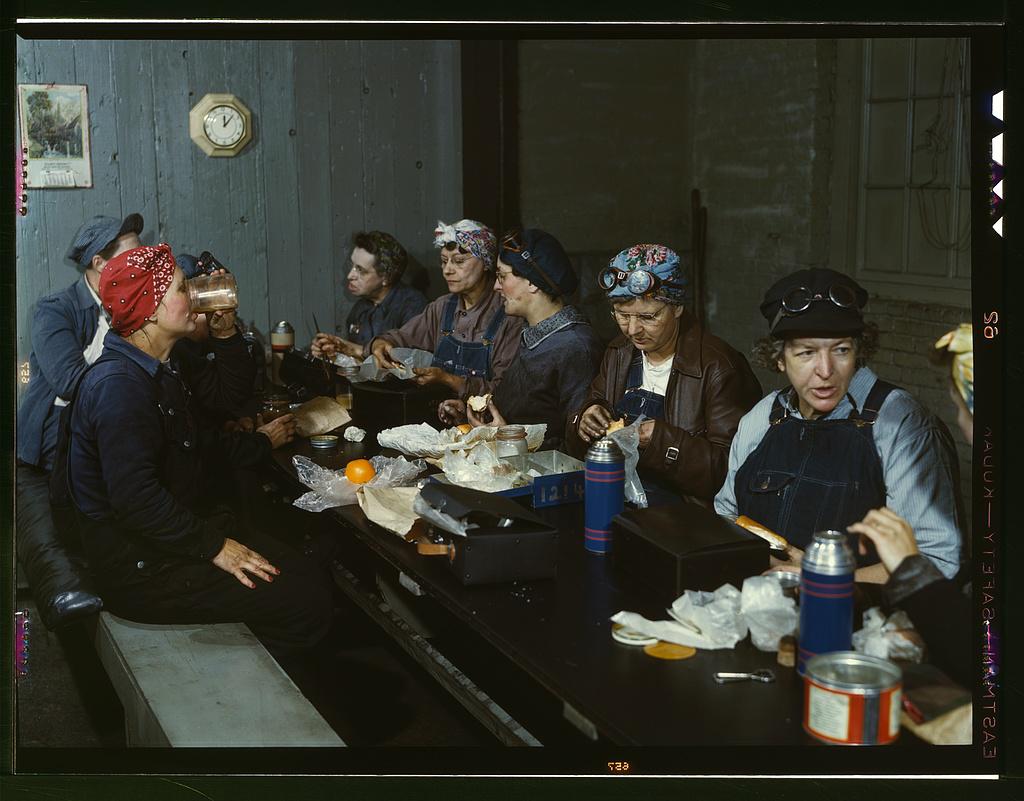 Women railroad workers eating lunch in a roundhouse rest room, Clinton, Iowa, April 1943 [1024 × 801]