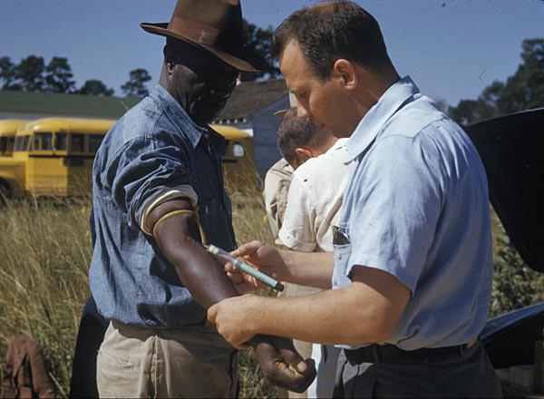 Tuskegee Syphilis Study participants with a nurse, Alabama 1932, for 40 years the US government secretly withheld Syphilis treatment from 399 Black men to study the disease’s natural progression (600 × 440 pixels)