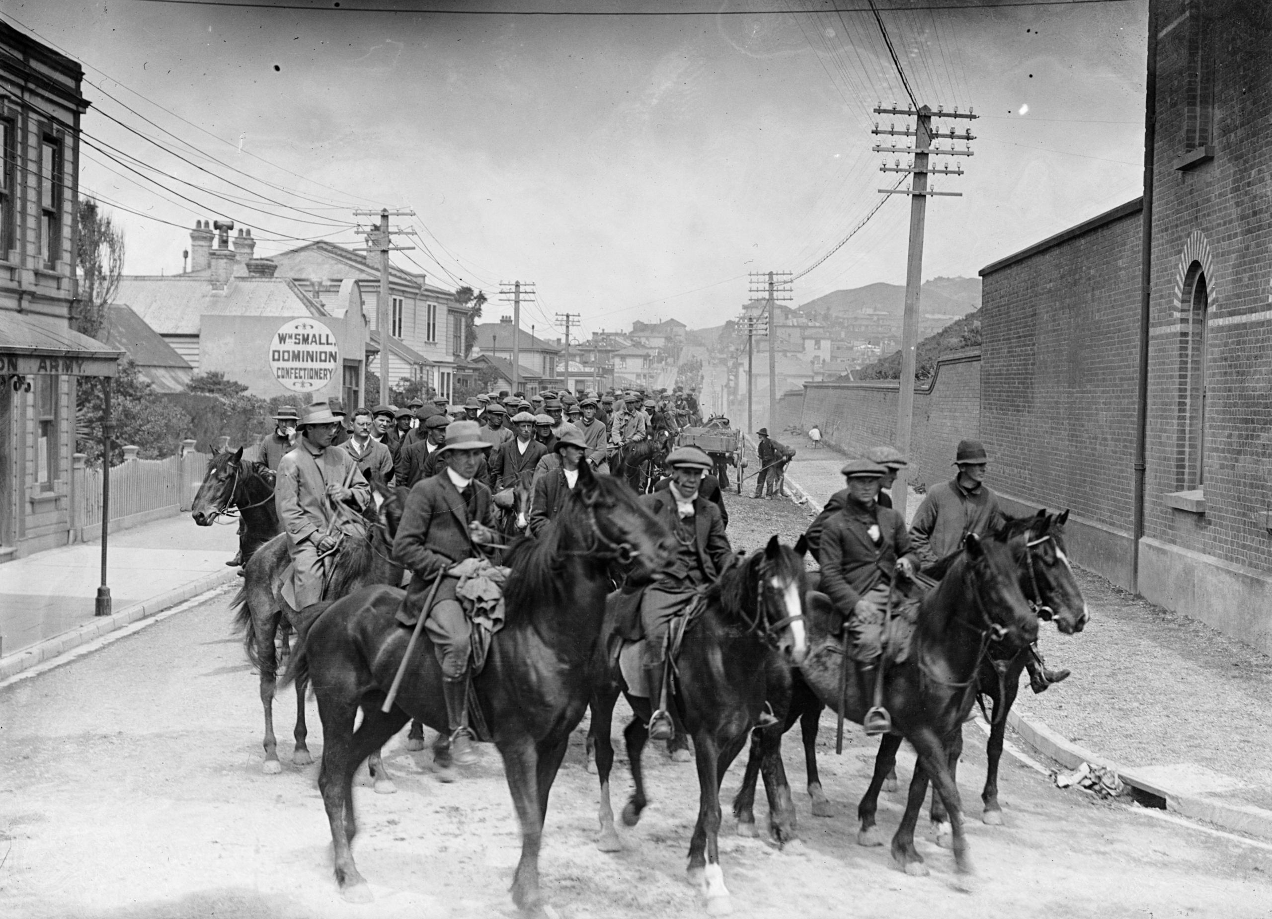 “Massey’s Cossacks”, mounted special constables (mostly young farmers) employed by the New Zealand government to confront strikers during the 1913 Great Strike, riding along Tasman Street in Wellington. [4829×3490]
