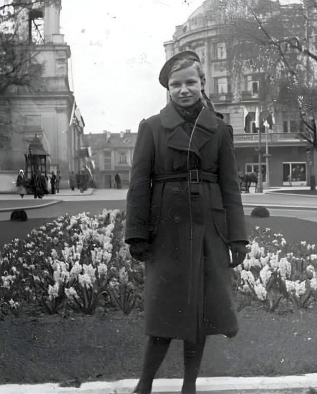Girl posing for a photo in a park right outside the Hotel Ritz in Białystok, Poland, 1930s. [1079×1341]