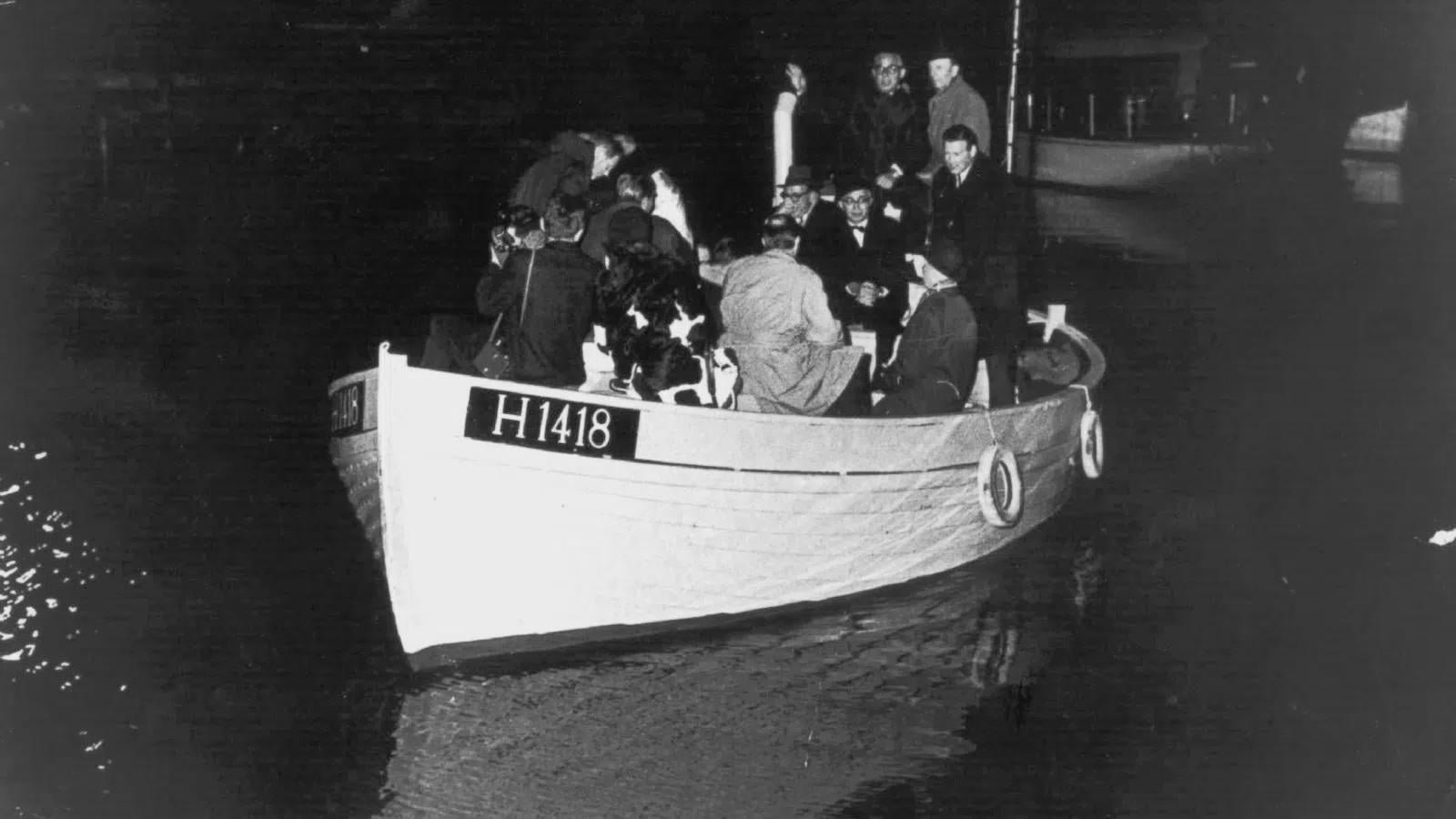 A group of Danish Jews aboard a fishing boat fleeing to Sweden across the Øresund Strait. These citizen-organized evacuation efforts saved around 7,000 Jews (1943) [900 × 506]