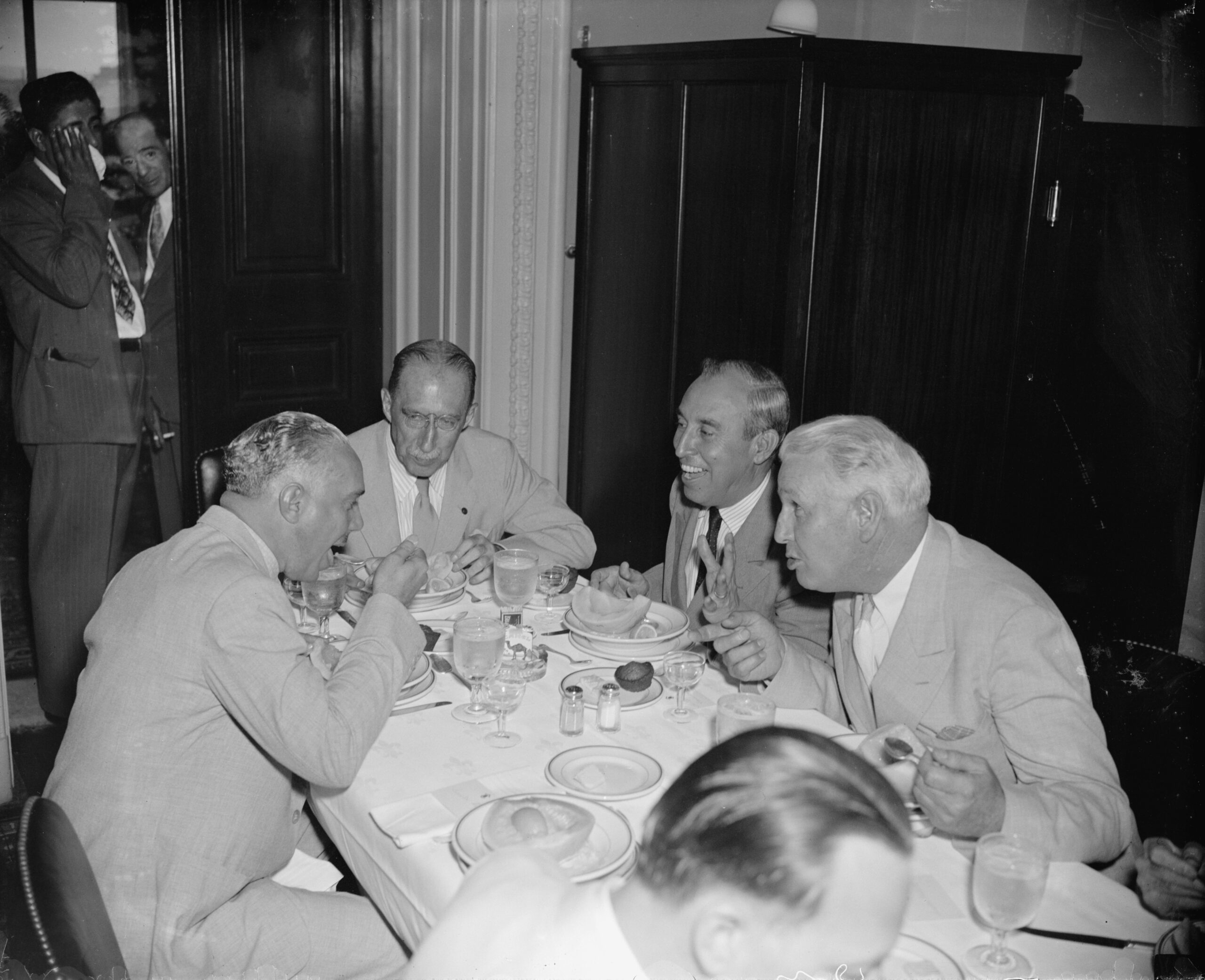 Dominican dictator Rafael Trujillo eating lunch with US Senators Theodore Green & Guy Gillette, 1939. Trujillo, who had deep connections within the US government, was on a goodwill tour to soften his international image after the infamous ‘Parsley Massacre’ he had ordered 2 years earlier (9164×7455)
