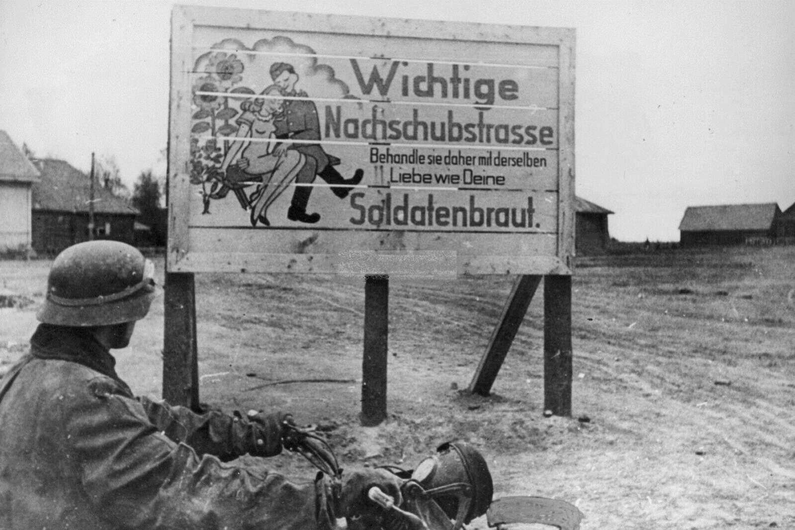 German sign at the Eastern Front, 1942. “Important supply road. Therefore treat it with the same love as your bride”[1599×1066]